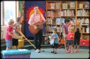 Children singing with Kevin Devine